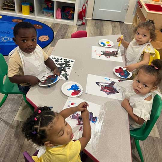 Small children at table.